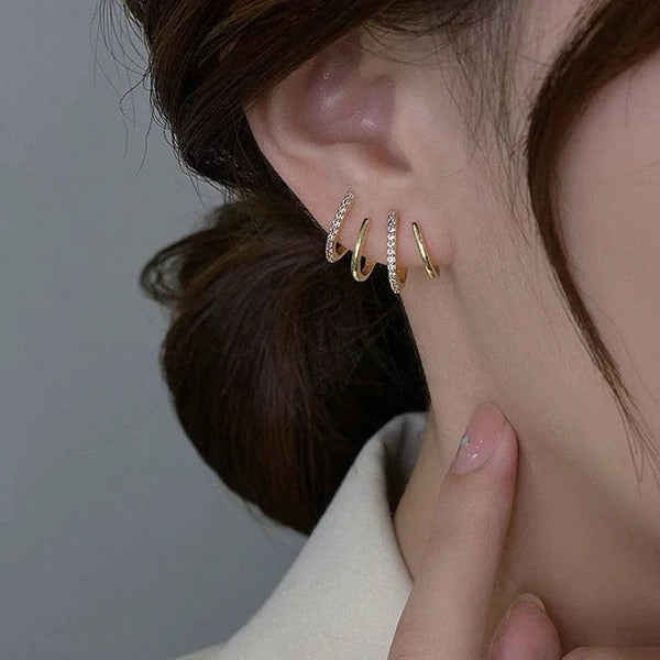 ¡PRODUCTO DE LUJO! PAR DE ARETES DE CUATRO GARRAS