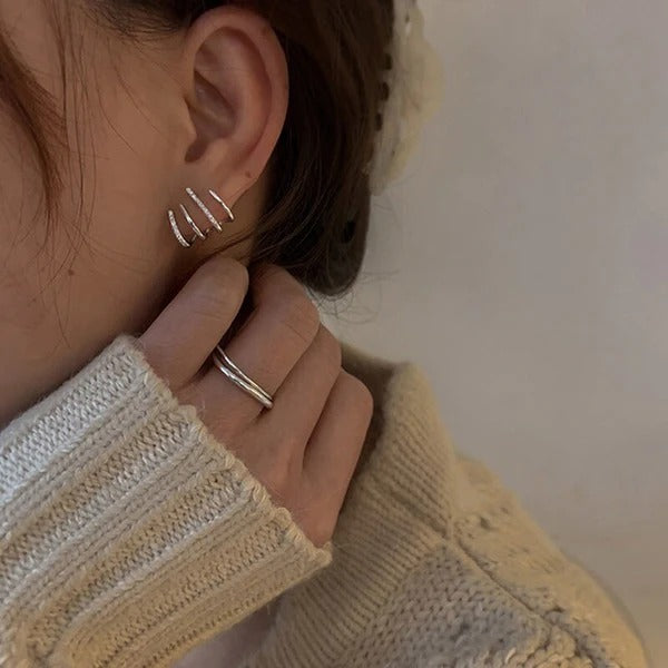¡PRODUCTO DE LUJO! PAR DE ARETES DE CUATRO GARRAS